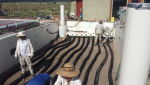 A photo of the Greenhouse heating system, a climate battery being installed.